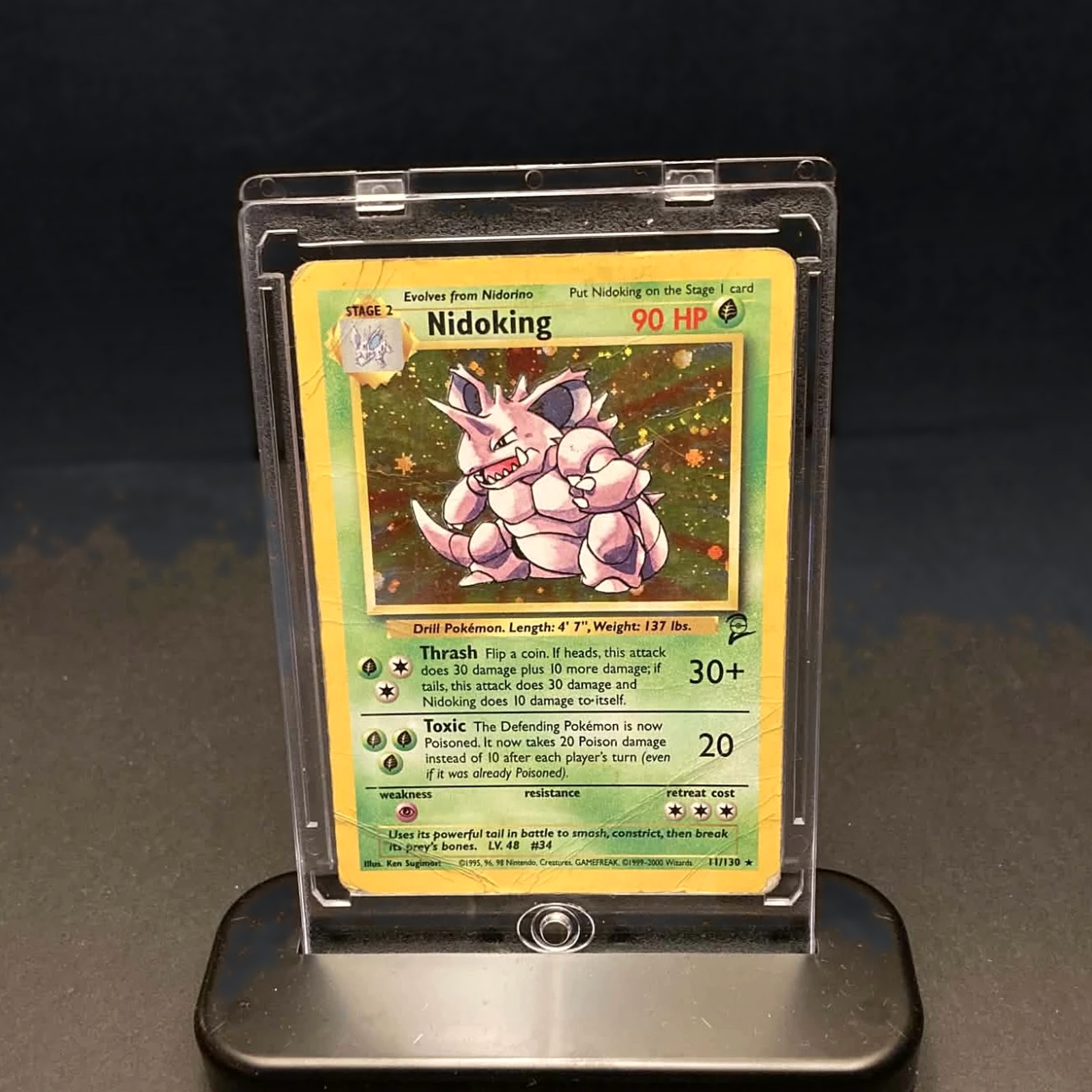 A raw card held in a clear 35PT magnetic case